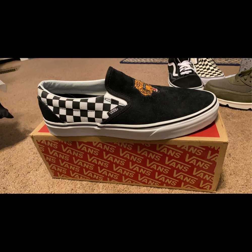 Vans “tiger check” slip ons